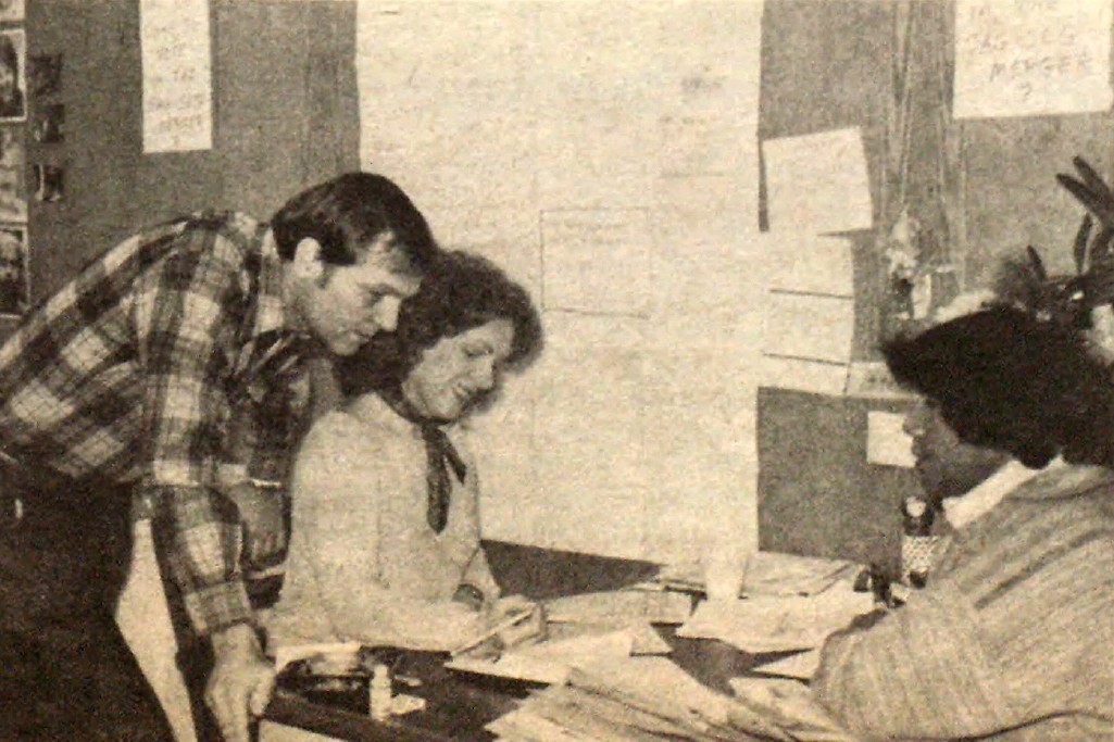 Eastern Principal Councilor Conard Fowkes and Eastern Chorus Councilor Mary Lou Westerfield help a member in the VITA office in 1984