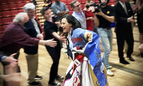 Ann Sanders circles the stage to bless the company of Camelot. Photo by David Thorn.